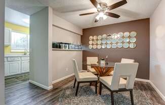 Dining room with a table and chairs and a ceiling fan  at Union Heights Apartments, Colorado Springs, CO