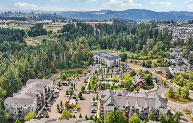 A bird's eye view of a residential area with houses and trees.