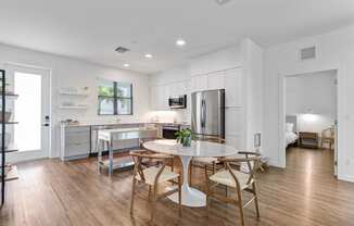a kitchen and dining room with a table and chairs at Odyssey, Fort Myers, Florida
