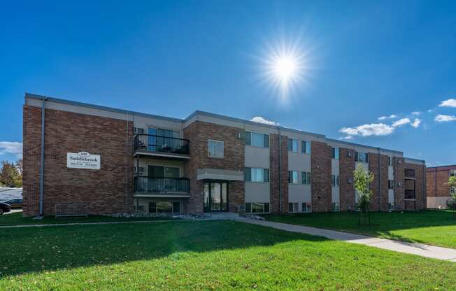 Fargo, ND Saddlebrook Apartments. An exterior of a three level apartment building.