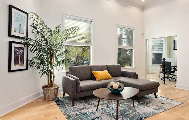 a living room with a couch and a coffee table at Sovereign at Overland Park, Overland Park  