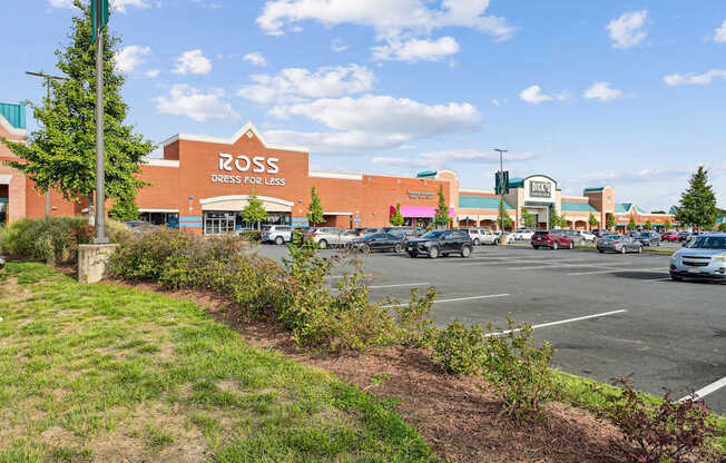 A parking lot in front of a Ross Dress for Less store.