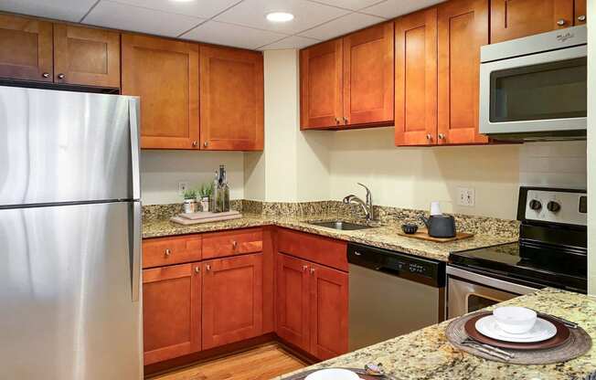 Kitchen with granite countertops and stainless steel appliances  at Lenox Club, Arlington, 22202