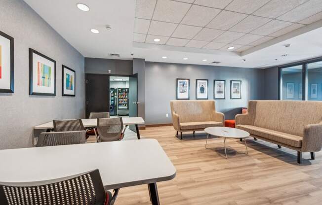 a waiting room with couches chairs and tables