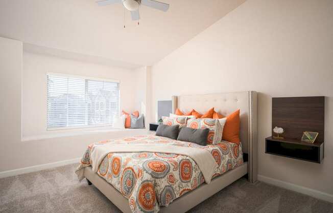 Model Master Bedroom with wall to wall carpet, ceiling fans and large window seat