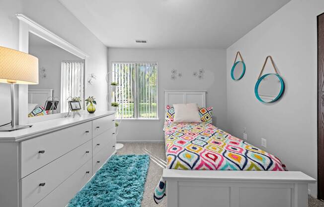 Bedroom with natural lighting at Westwood Village Apartments in Westland, MI