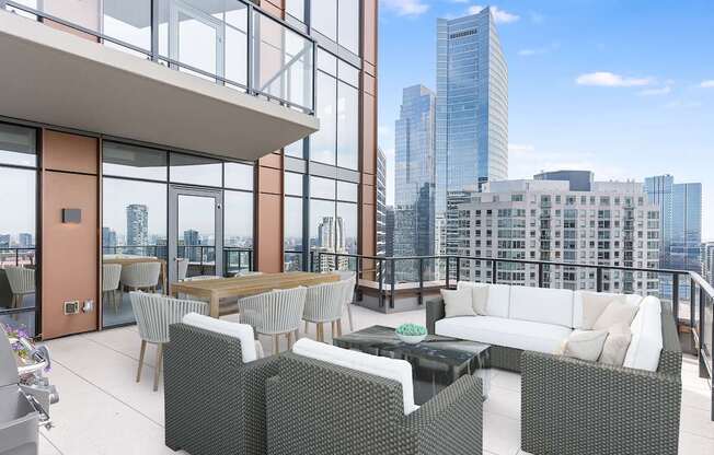 a rendering of a balcony with a couch and chairs and a table at Cassidy on Canal, Chicago, IL, 60606
