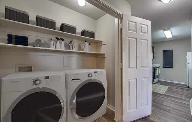 A laundry room with a washer and dryer.