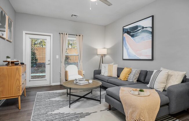 a living room with a couch and a table