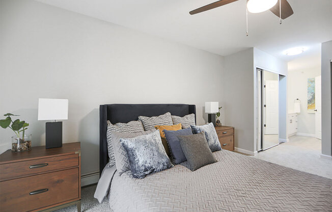 Bedroom With Ceiling Fan at Rivers Edge Apartments, Waukesha, Wisconsin