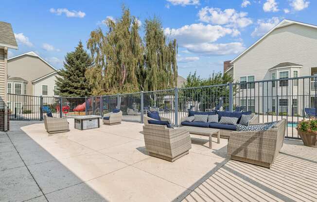 the terrace at the preserve apartments with couches and chairs