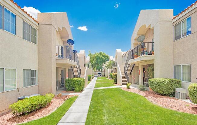 Lush walkways of Country Club at Valley View Senior Apartments in Las Vegas, NV, For Rent. Now leasing 1 and 2 bedroom apartments.