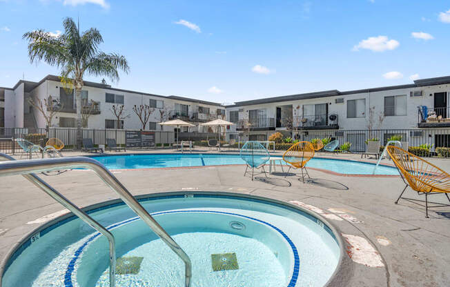 A swimming pool with a metal ladder in the middle of it.