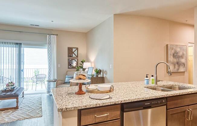 a kitchen with a sink and a dishwasher  at Sapphire at Centerpointe, Midlothian, VA, 23114