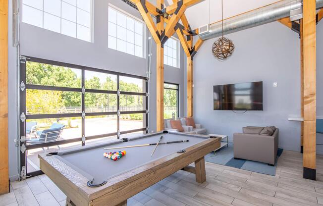 a room filled with furniture and a large window