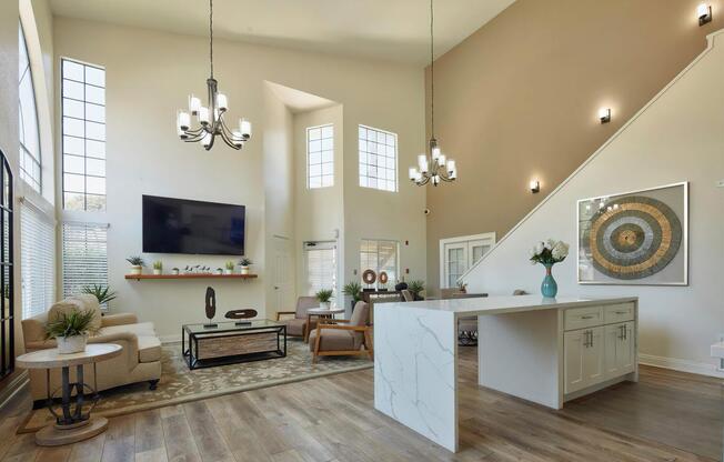 a living room filled with furniture and a large mirror