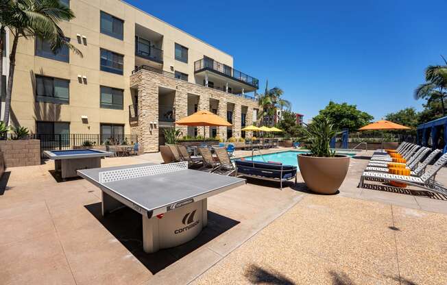 our apartments offer a clubhouse with a pool and ping pong table