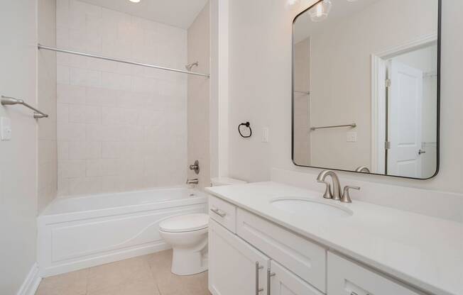 a bathroom with a sink toilet and bathtub