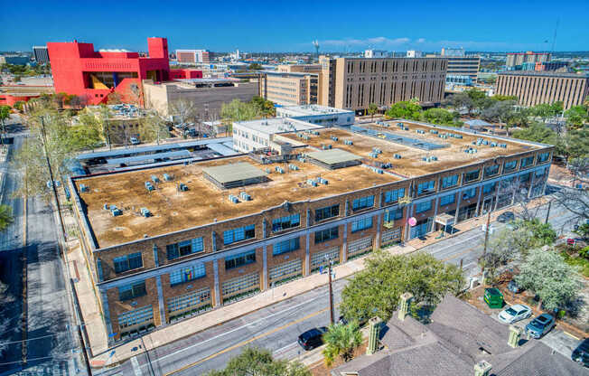 A large building with a red structure in the background.