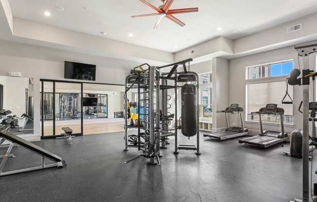 Fitness center with yoga studio, treadmills, and free-weights