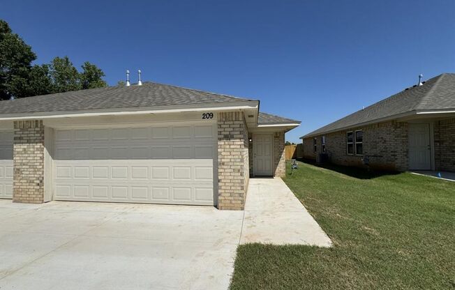 Luxury NEW 3 Bedroom 2 Bathroom Duplex with 2 Car Garage in Yukon Schools