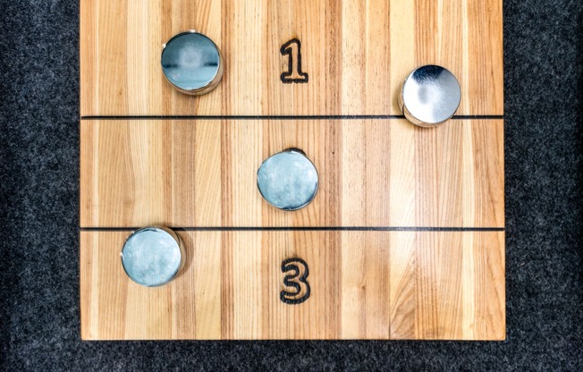 a wii game board with three balls on it
