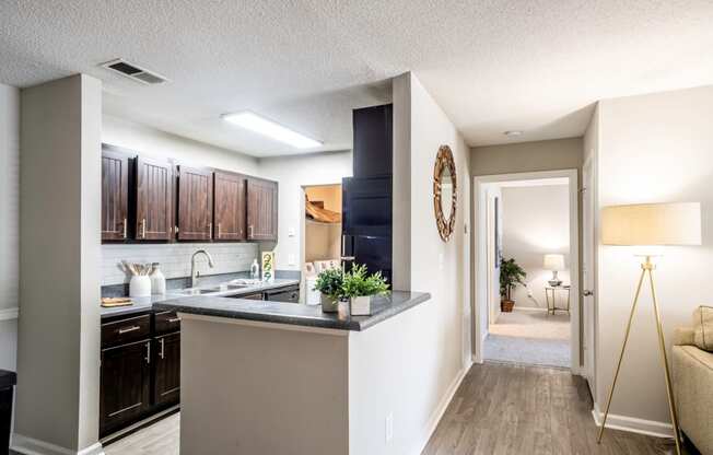 Kitchen and hallway to bedroom located at Addison on Cobblestone located in Fayetteville, GA 30215