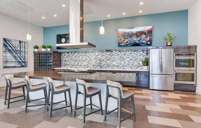 A kitchen with a stone backsplash and a refrigerator.