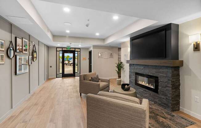 A living room with a fireplace and a television.