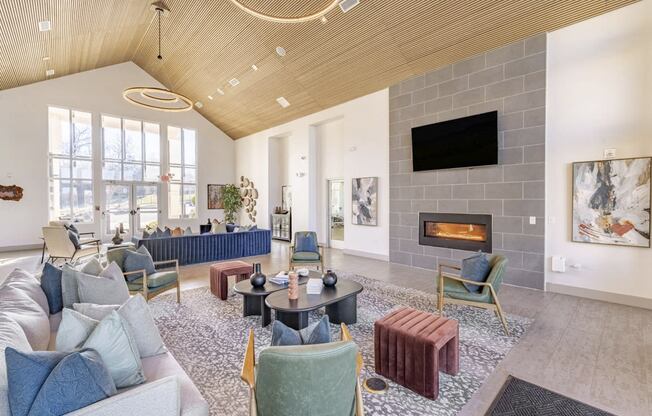 community room with couches and chairs and a fireplace at Sycamore at Tyvola, North Carolina, 28217