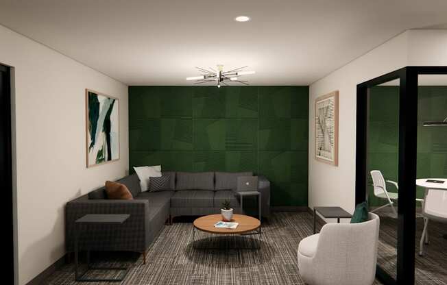 A modern living room with a grey sofa, a coffee table, and a green accent wall.
