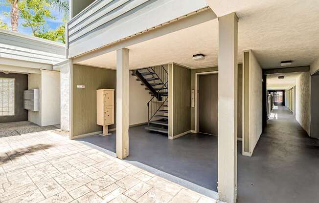 A long hallway with a staircase on the right side.