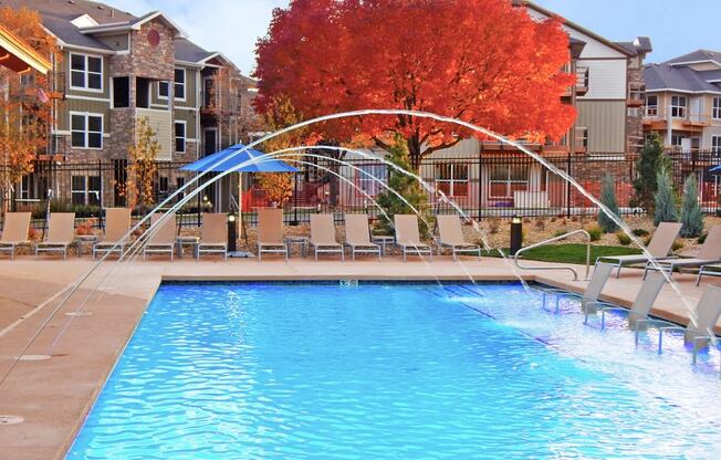 Outdoor Heated Swimming Pool and Sundeck to Tan and Lounge at Pet Friendly Apartments Near Fort Collins