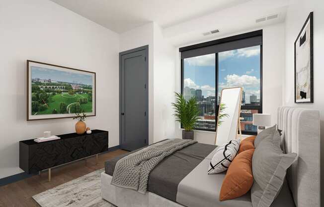 a bedroom with a bed and a large window