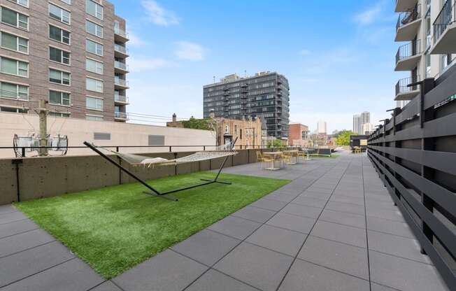 a grassy area on the roof of an apartment building