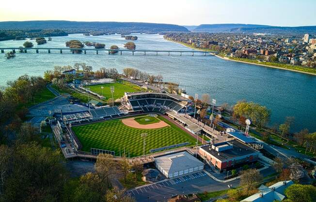 an aerial view of a baseball stadium next to a river