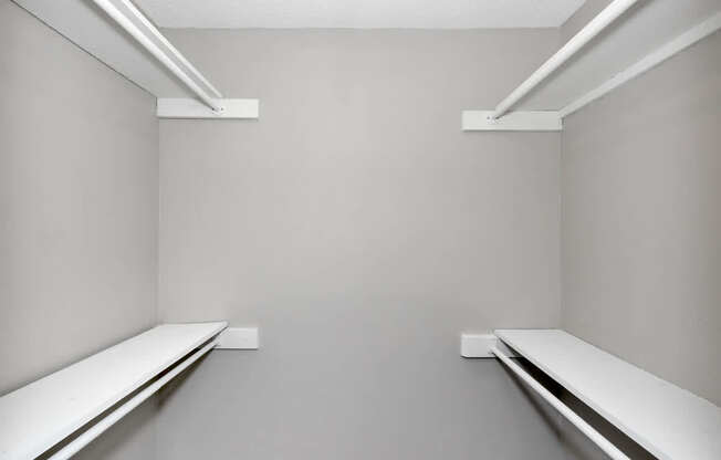 Two white shelves on the wall.