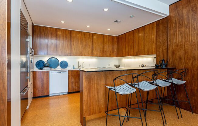 Meticulously maintained 1br + office apartment featuring original 1961 design elements, 24-hour doorman, covered garage parking w/ EV charger and storage.