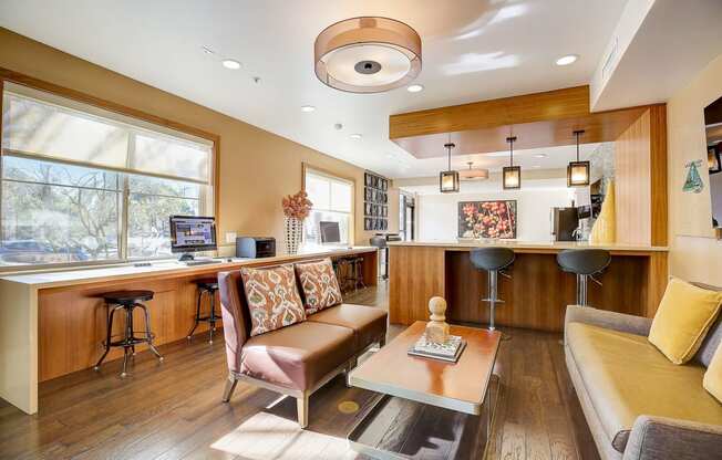 a living room with a kitchen and a couch