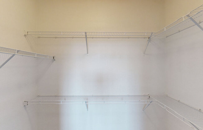 Empty shelves in a room with white walls.