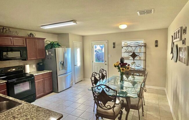 Elegant four‑bedroom corner‑lot home with hardwood floors, modern kitchen, master suite, and community amenities near Hwy I‑20.