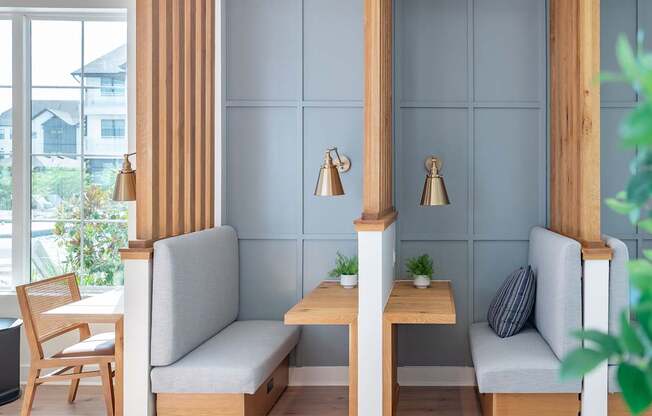 a seating area with two chairs and a table
