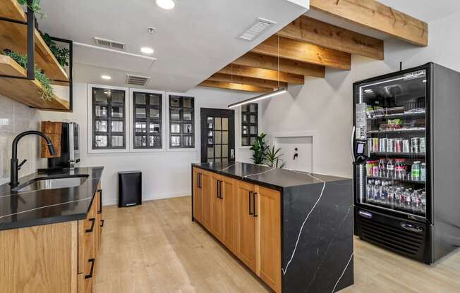 A modern kitchen with wooden cabinets and a black countertop.