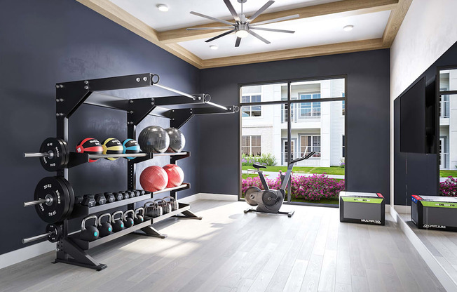 a home gym with a weights rack and a large window