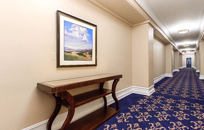 hallway with a bench and a painting on the wall at the calverton apartments in washington dc