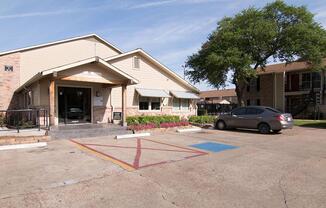 a small house in a parking lot