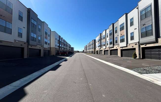 a row of apartment buildings on the side of a street at Meridian at CityPlace, Woodbury, 55125