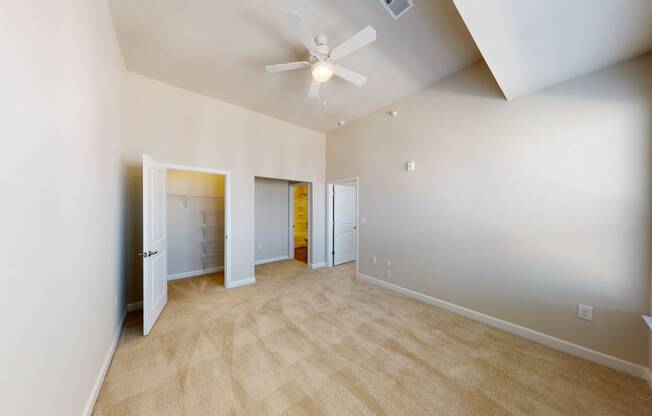 Bedroom with carpet, closet, ceiling fan