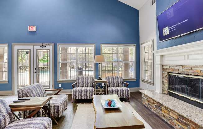 a living room with blue walls and a fireplace