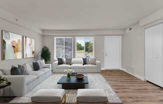 a living room with white walls and a wooden floor